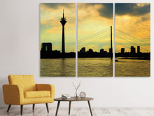 Laden Sie das Bild in den Galerie-Viewer, Leinwandbild 3-teilig Skyline im Abendlicht