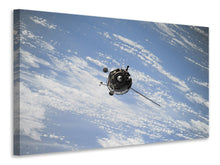 Laden Sie das Bild in den Galerie-Viewer, Leinwandbild Ein Satellit über den Wolken